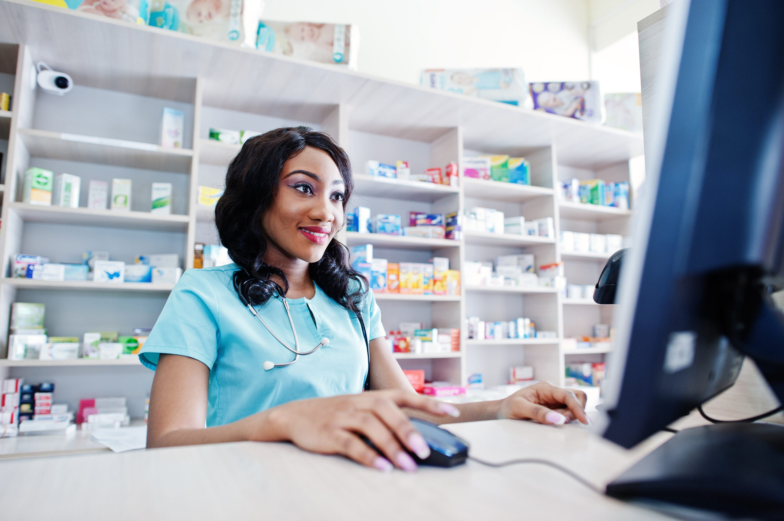 African american pharmacist cashier working in drugstore at hospital pharmacy. African healthcare.