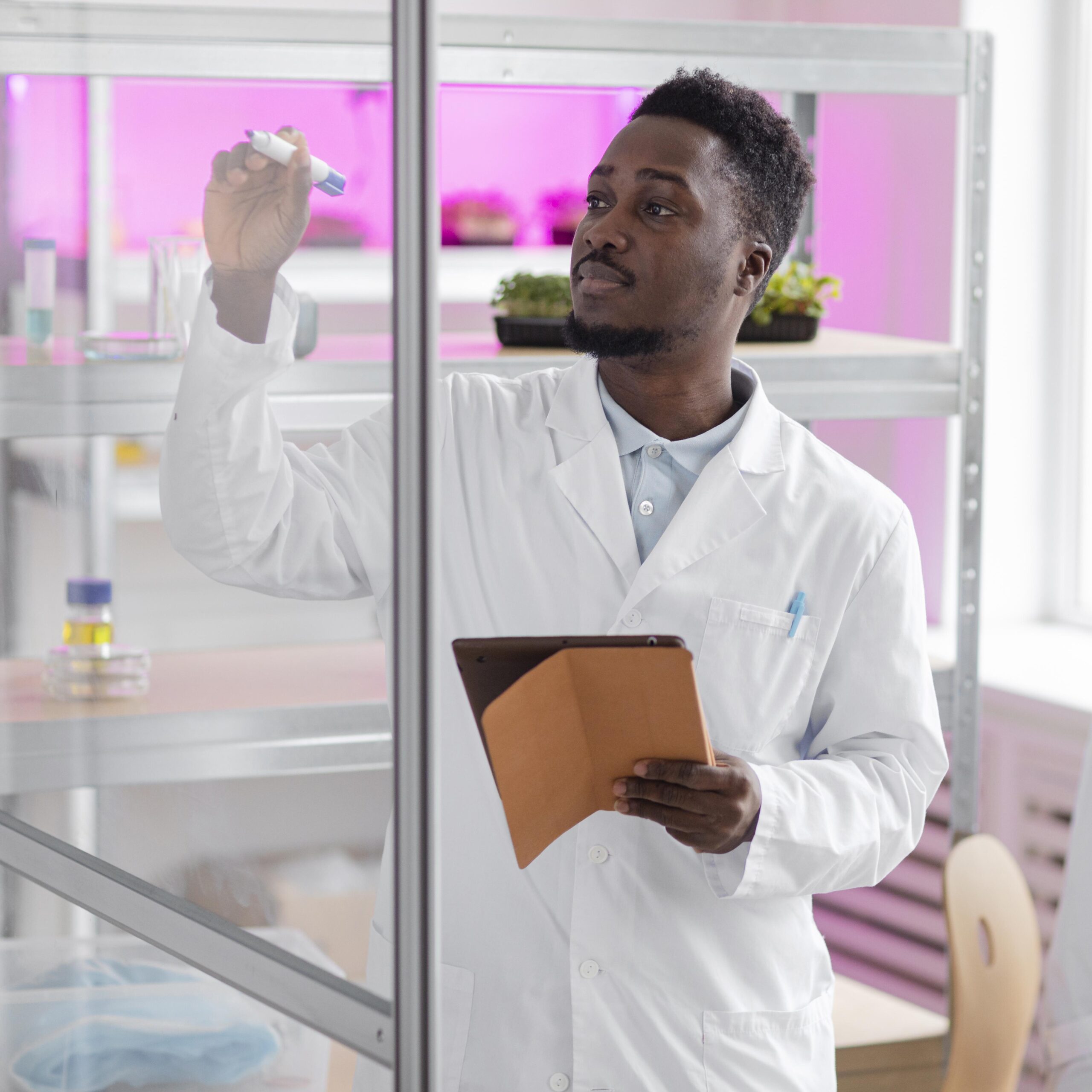 male-researcher-biotechnology-laboratory-with-tablet (1)